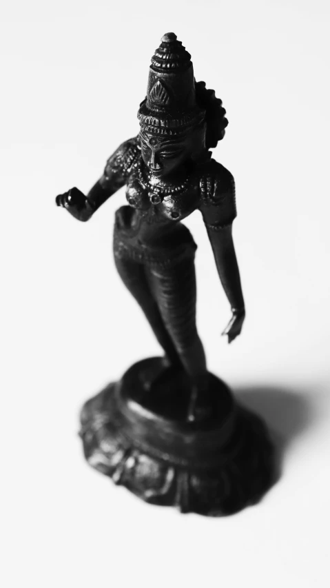 a black and white photo of a statue, a statue, indian goddess, 9 0 mm studio photograph tiny, mini figure, brass woman
