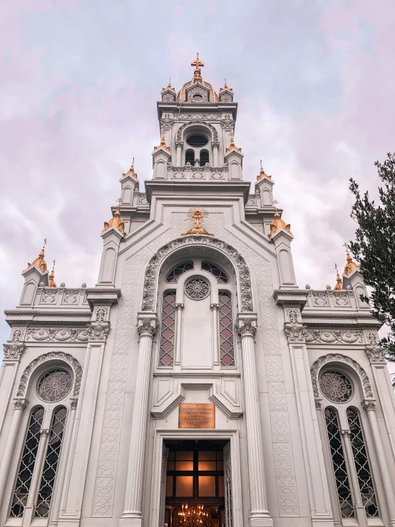 a large white church with a clock tower, by Julia Pishtar, unsplash contest winner, art nouveau, silver gold red details, symmetrical front view, san francisco, on a great neoclassical square