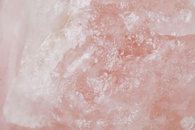 a close up of a pink rock on a table, cotton candy, detailed product image, gemstone forehead, rubi