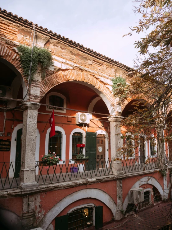 a couple of buildings that are next to each other, inspired by Serafino De Tivoli, pexels contest winner, renaissance, big arches in the back, olive green and venetian red, 2 5 6 x 2 5 6 pixels, balcony