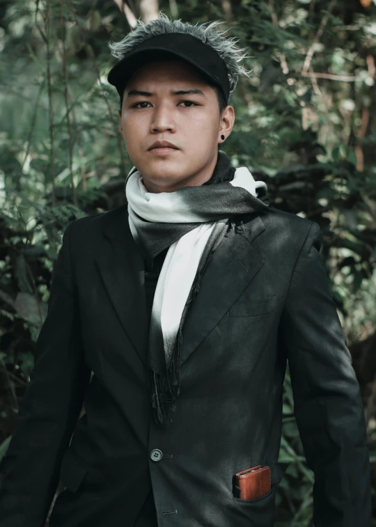 a man in a black jacket and a white scarf, inspired by Rudy Siswanto, sumatraism, in a jungle, avatar image