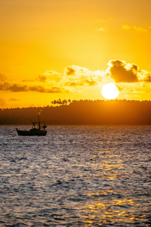 a boat floating on top of a large body of water, by Peter Churcher, pexels contest winner, sunset golden hour hues, salvador, fishing boat, today\'s featured photograph 4k