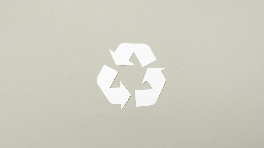 a piece of paper with a recycling symbol cut out of it, by Shigeru Aoki, unsplash, plasticien, on a gray background, 3 2 x 3 2, ffffound, minimalist wallpaper