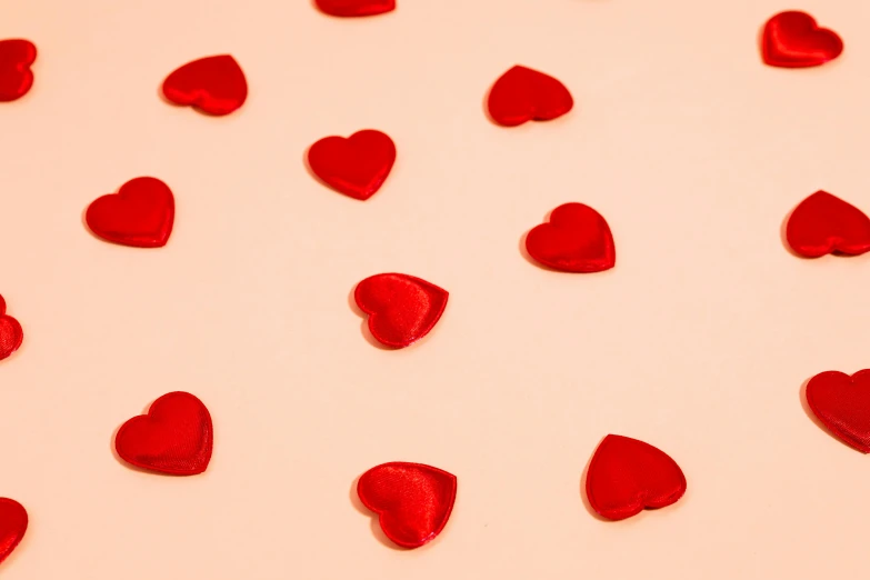 a white table topped with lots of red hearts, an album cover, pexels, pink background, red-fabric, closeup - view, thumbnail