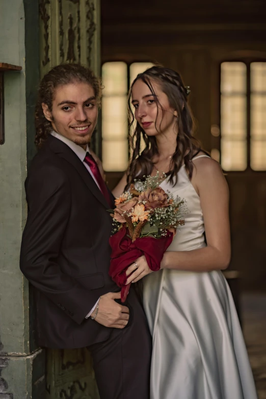 a man and a woman standing next to each other, a colorized photo, by Lucia Peka, pexels contest winner, renaissance, bouquet, headshot and bodyshot, indoor picture, modelling