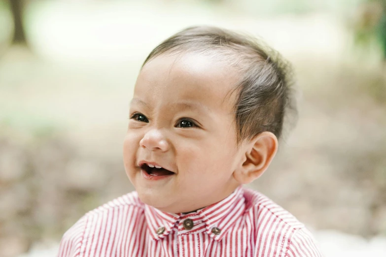 a close up of a baby wearing a bow tie, inspired by Reuben Tam, pexels contest winner, happening, earing a shirt laughing, light stubble with red shirt, wearing stripe shirt, ross tan