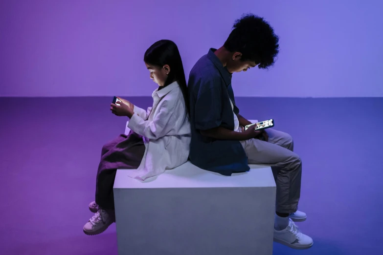 a couple of people sitting on top of a white cube, trending on pexels, realism, mobile game, ((purple)), kids, cellphone