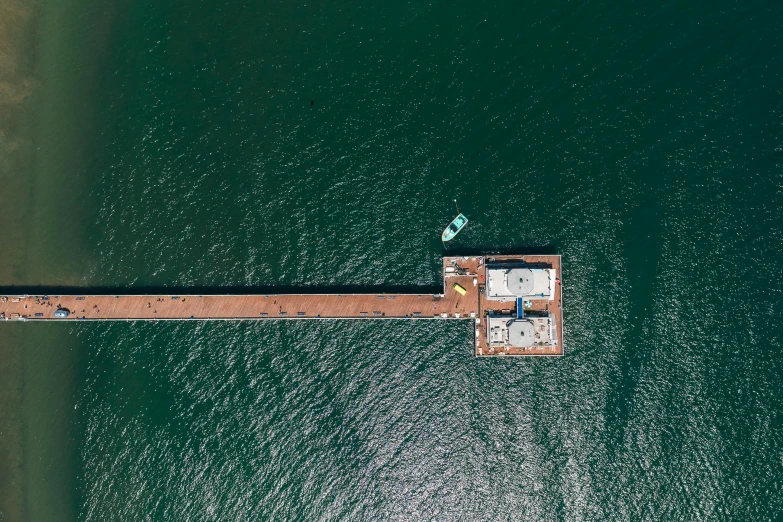 a pier in the middle of a body of water, pexels contest winner, hurufiyya, satellite imagery, helipad, california;, float