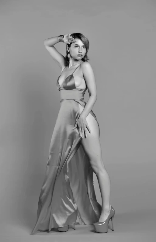 a black and white photo of a woman in a dress, a 3D render, inspired by Horst Antes, reddit, photorealism, satin silver, glamorous jill valentine, claire forlani, 40 years old women