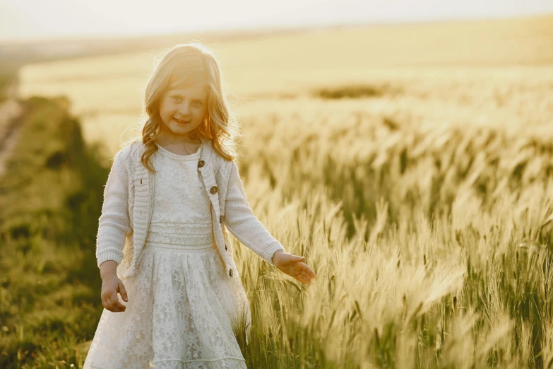 a little girl standing in a field of tall grass, by David Simpson, pexels contest winner, evening sunlight, white, wheat fields, elegantly dressed