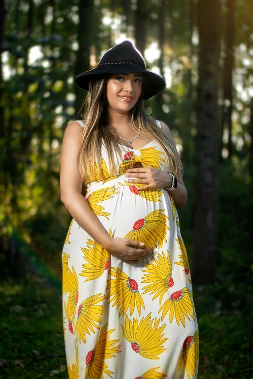 a pregnant woman wearing a sunflower dress in the woods, inspired by Samuel Silva, white, caio santos, grey, colors : yellow sunflowers