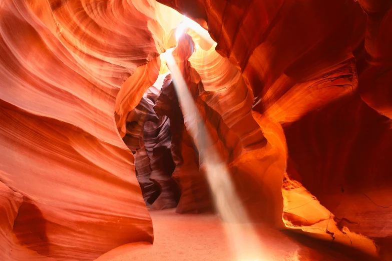 the sun shines through a narrow slot in a canyon, by Jessie Algie, pexels contest winner, art nouveau, swirls of fire, sandstone, bathing in light, complex lights