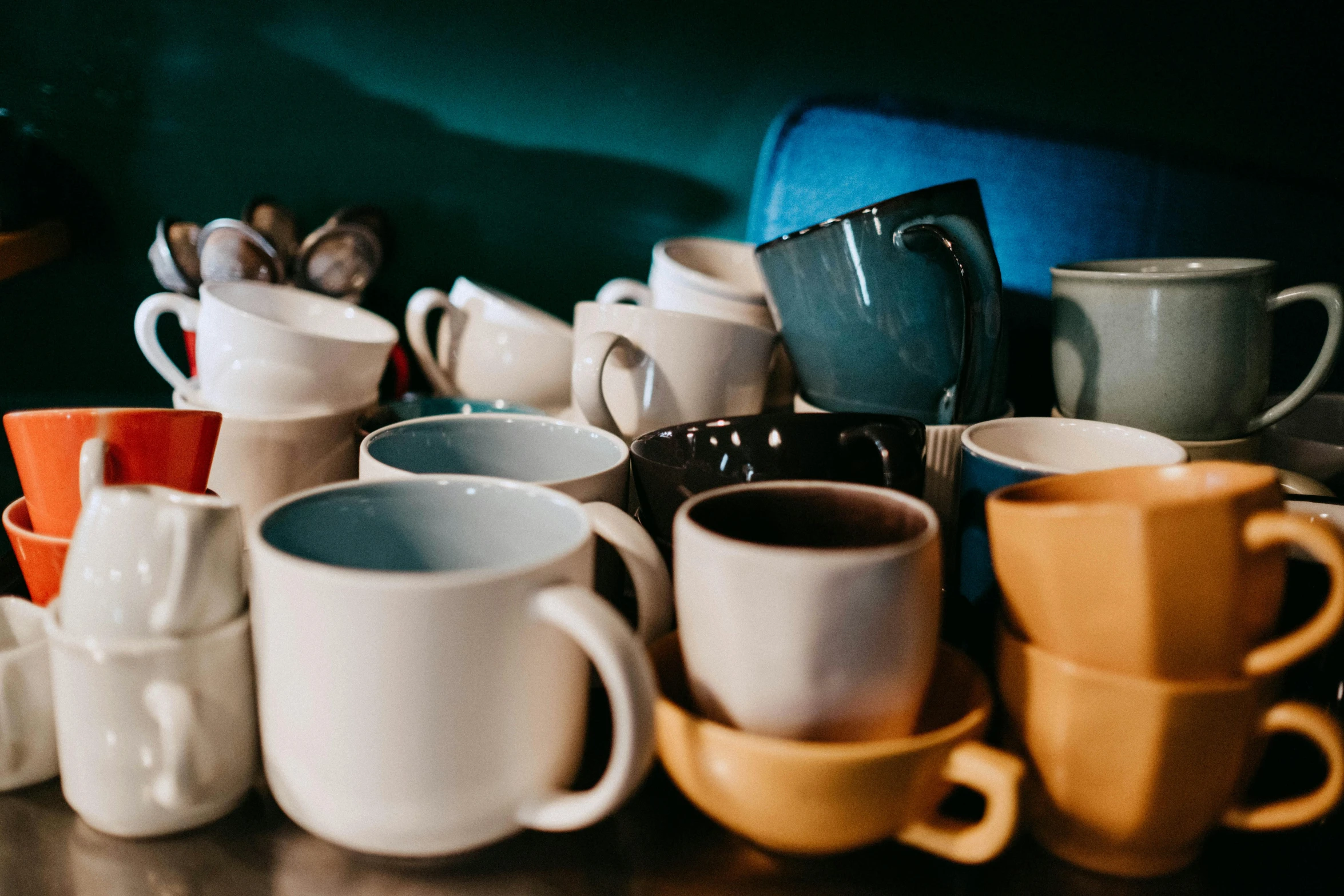 a pile of coffee cups sitting on top of a table, by Lee Loughridge, trending on unsplash, fan favorite, starbucks aprons and visors, moroccan tea set, vintage colours