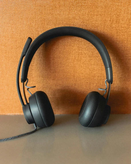 a pair of headphones sitting on top of a table, square, black, front facing, thumbnail