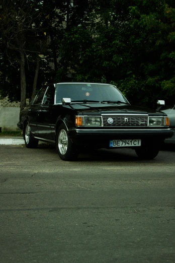a black truck parked on the side of the road, an album cover, by Sven Erixson, pexels contest winner, toyota cresta, slavic style, sportcar, front view 1 9 9 0