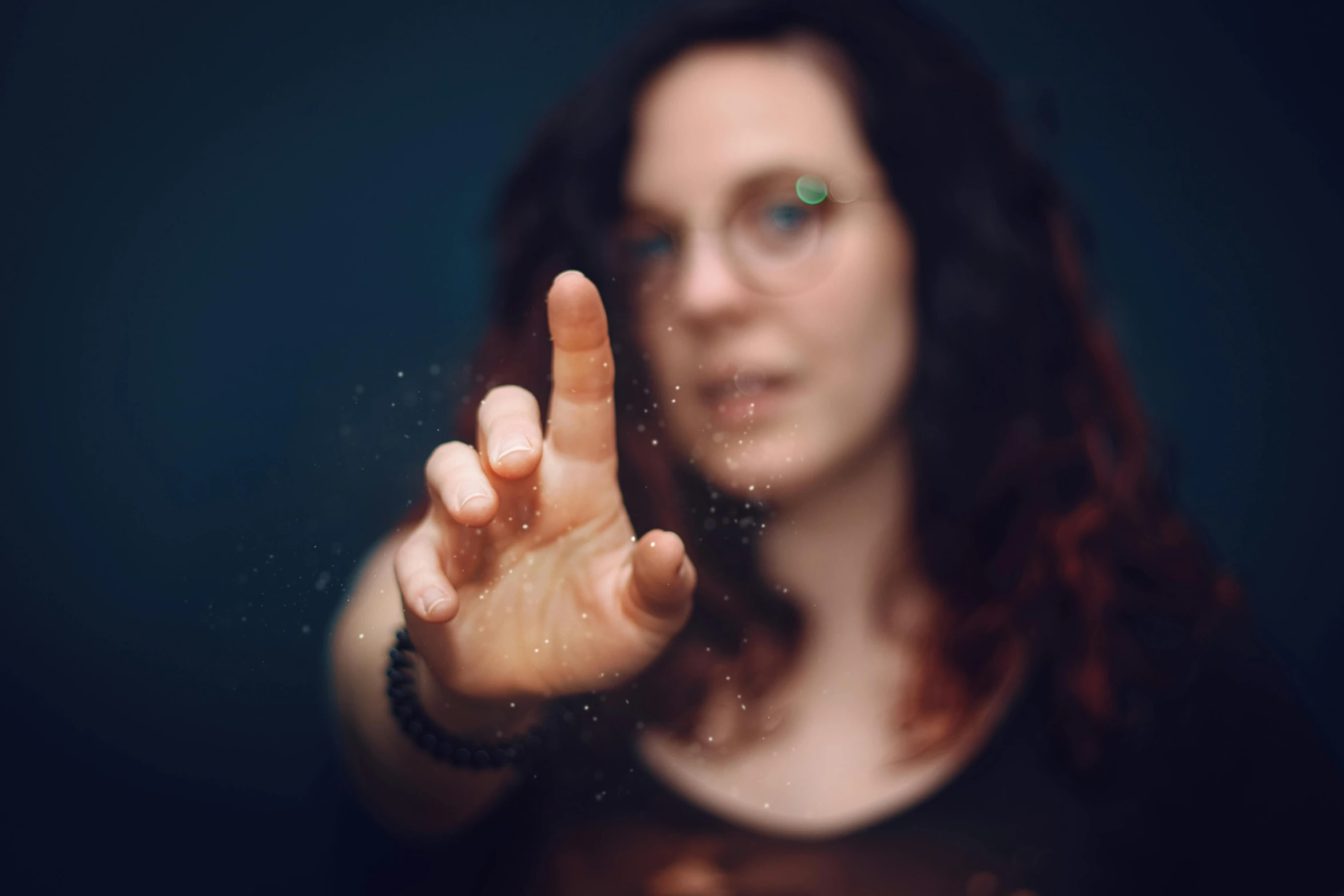 a woman making a peace sign with her hand, a picture, by Adam Marczyński, pexels, holography, bokeh soft, avatar image, dust particle, portrait of ultra realistic