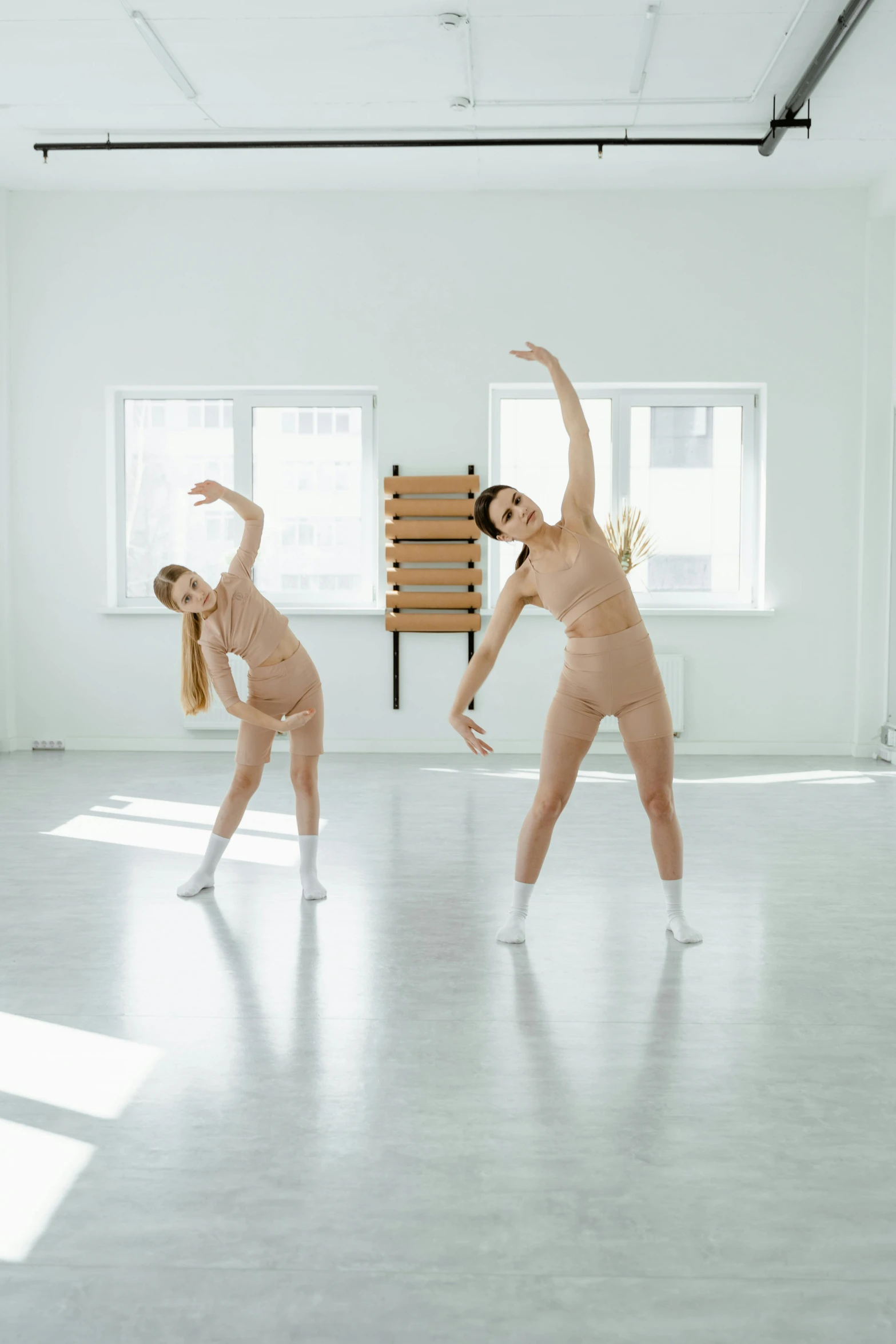 a group of naked women in a dance studio, an album cover, unsplash, adult pair of twins, moleksandra shchaslyva, square, full body 8k