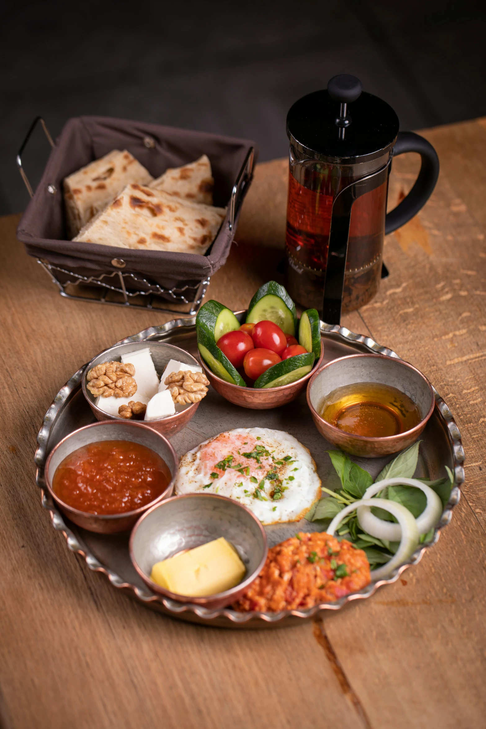 a plate of food sitting on top of a wooden table, dau-al-set, grey, medium, at home, mix