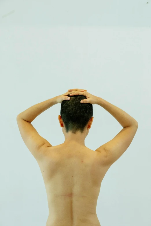 a man standing in front of a mirror with his hands on his head, inspired by Ren Hang, flickr, showing her shoulder from back, showstudio, swimming, rinko kawauchi