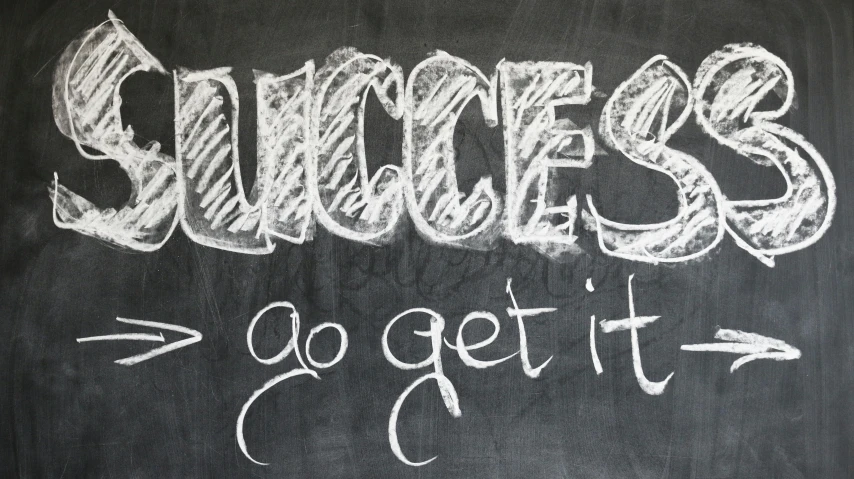 a chalkboard with the words success and go get it written on it, chalk art, by Heather Hudson, pixabay, graffiti, hollywood promotional image, surgery, very ornate, huge success