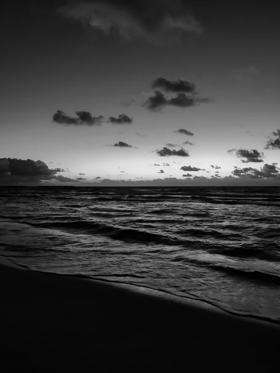 a black and white photo of the ocean, morning dawn, varadero beach, night. by greg rutkowski, egor letov