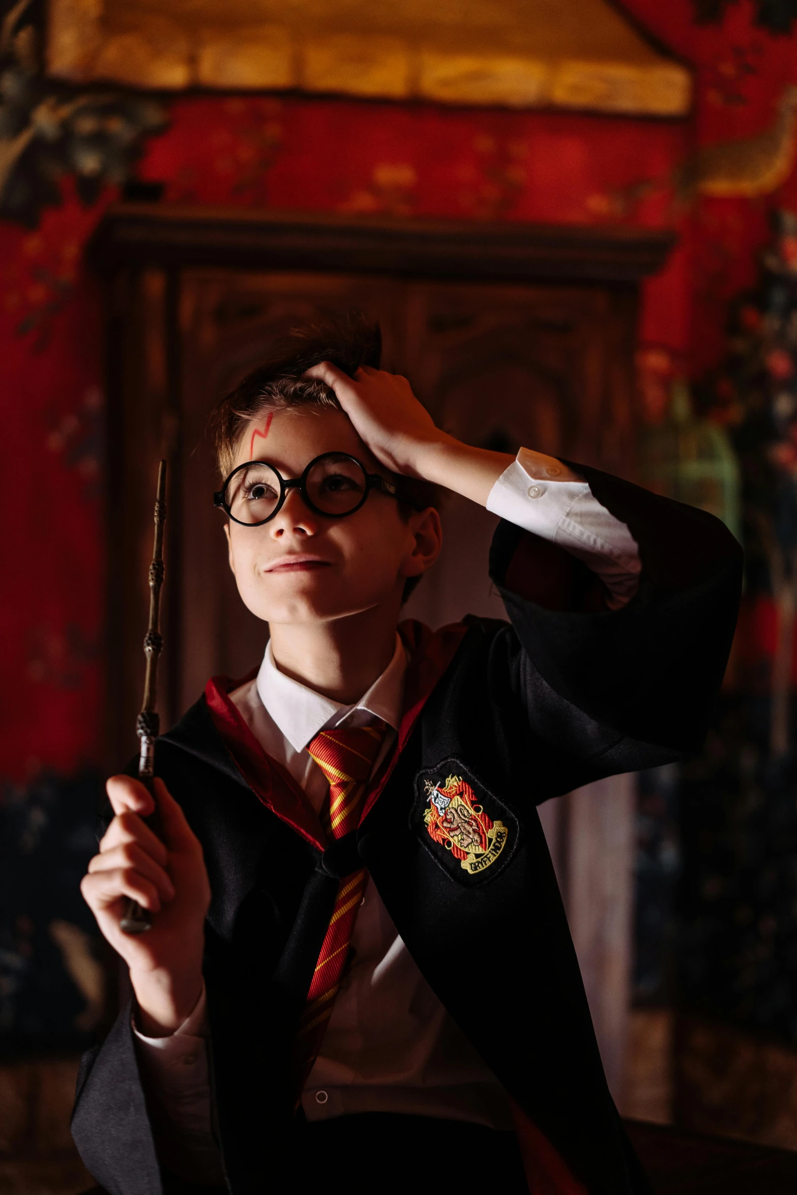 a man in a harry potter costume holding a wand, a picture, trending on pexels, happening, boys, goggles on forehead, indoor scene, ( ( theatrical ) )