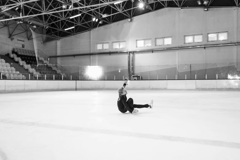 a black and white photo of a person on a skateboard, by Emma Andijewska, pexels contest winner, figuration libre, sitting on ice throne, lying on an empty, olympics footage, blonde