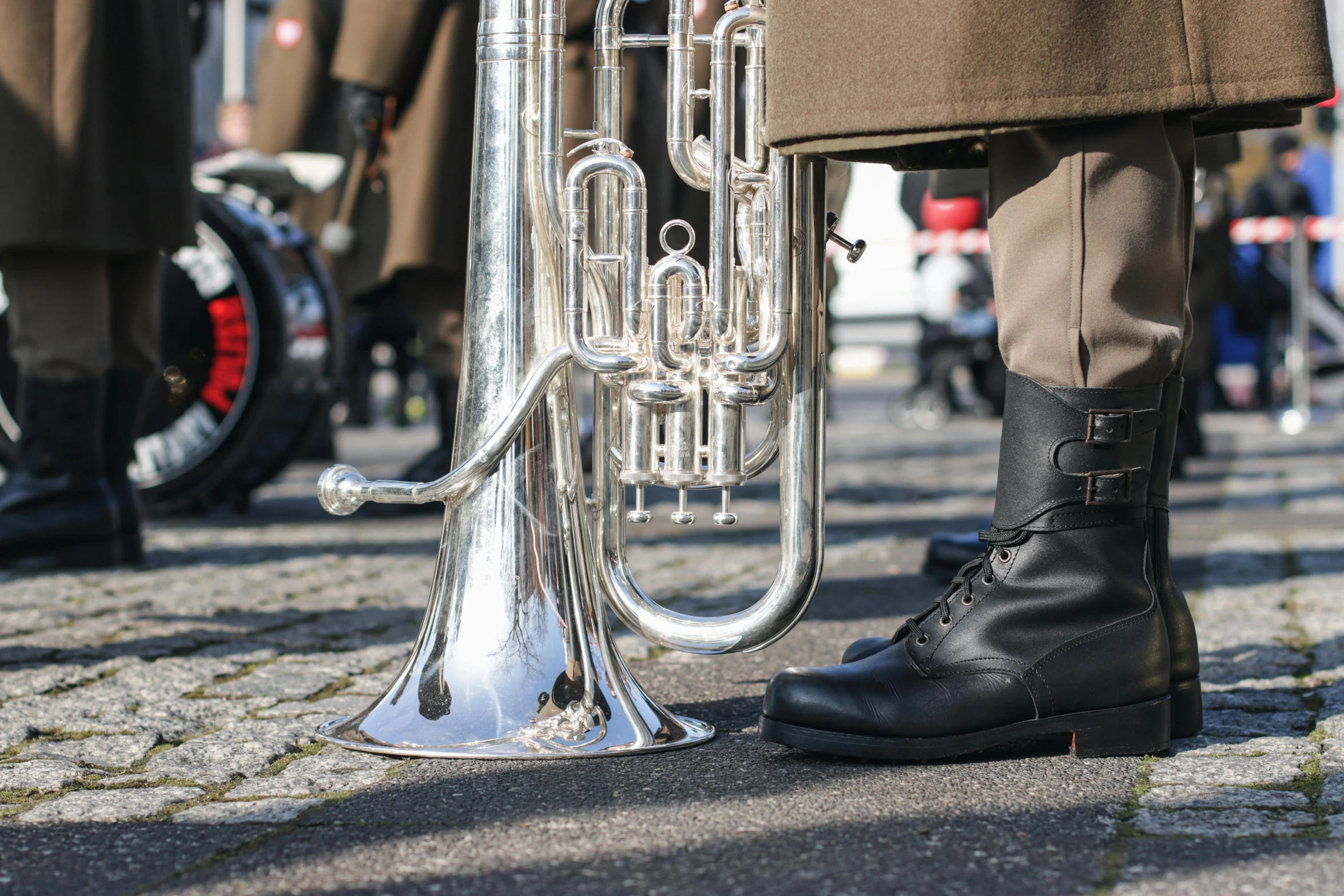 a close up of a person with a trumpet, military boots, 🚿🗝📝, ceremonial, surrounding the city