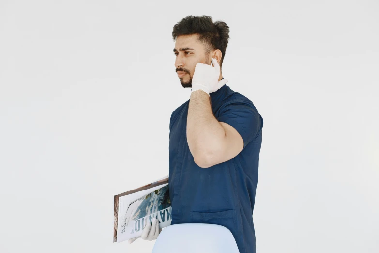 a man in a blue shirt talking on a cell phone, an album cover, trending on pexels, hyperrealism, labcoat, white sleeves, professional profile picture, vitaly bulgarov