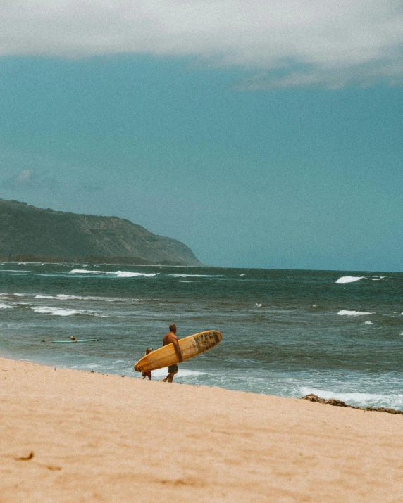 a person walking on a beach with a surfboard, pexels contest winner, renaissance, hills and ocean, hawaii beach, thumbnail, tan complexion