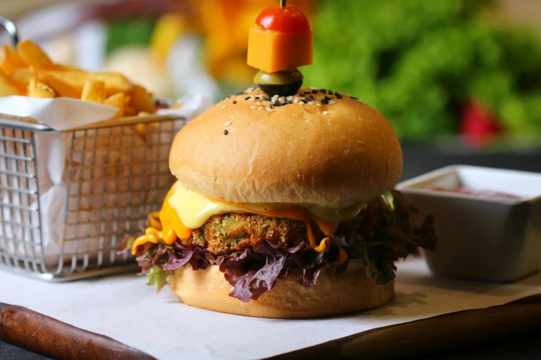 a hamburger sitting on top of a table next to a basket of fries, pexels contest winner, orange fluffy belly, profile image, crispy buns, malaysian