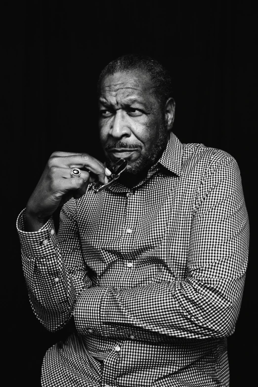 a black and white photo of a man in a shirt and tie, by Clifford Ross, morgan freeman, jeff bridges, ƒ/3.5, medium format