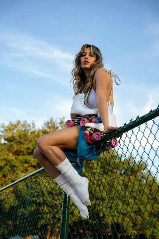 a woman sitting on top of a tennis court holding a racquet, an album cover, by Drew Tucker, trending on pexels, happening, standing on a skateboard, ana de armas, on a tree, vests and corsets