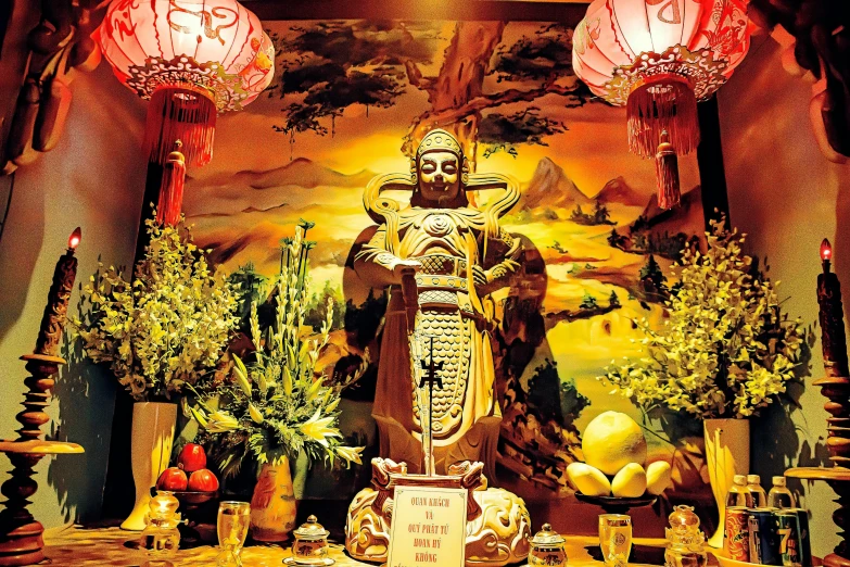 a statue sitting on top of a wooden table, symbolism, golden treasures on the walls, vibrant setting, recipe, ben lo