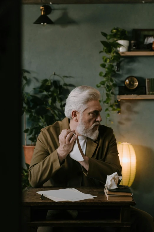 a man and a woman sitting at a table, a character portrait, pexels contest winner, gray beard, pondering, doctor, trending photo