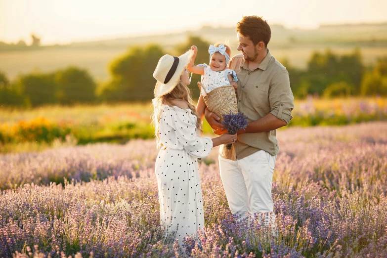 a man and woman holding a baby in a lavender field, square, inspect in inventory image, lifestyle, thumbnail