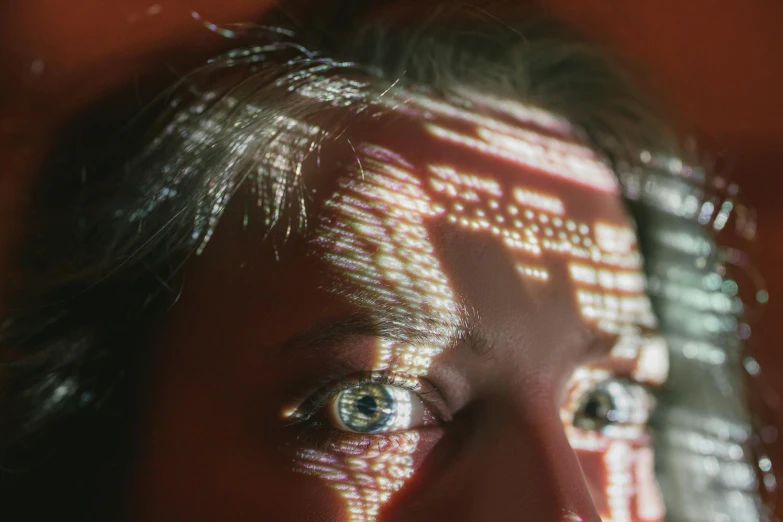 a close up of a person's face with a building in the background, a hologram, pexels contest winner, hyperrealism, eyes are glowing red lightbulbs, woman with braided brown hair, raytracing shadows, electronics see through