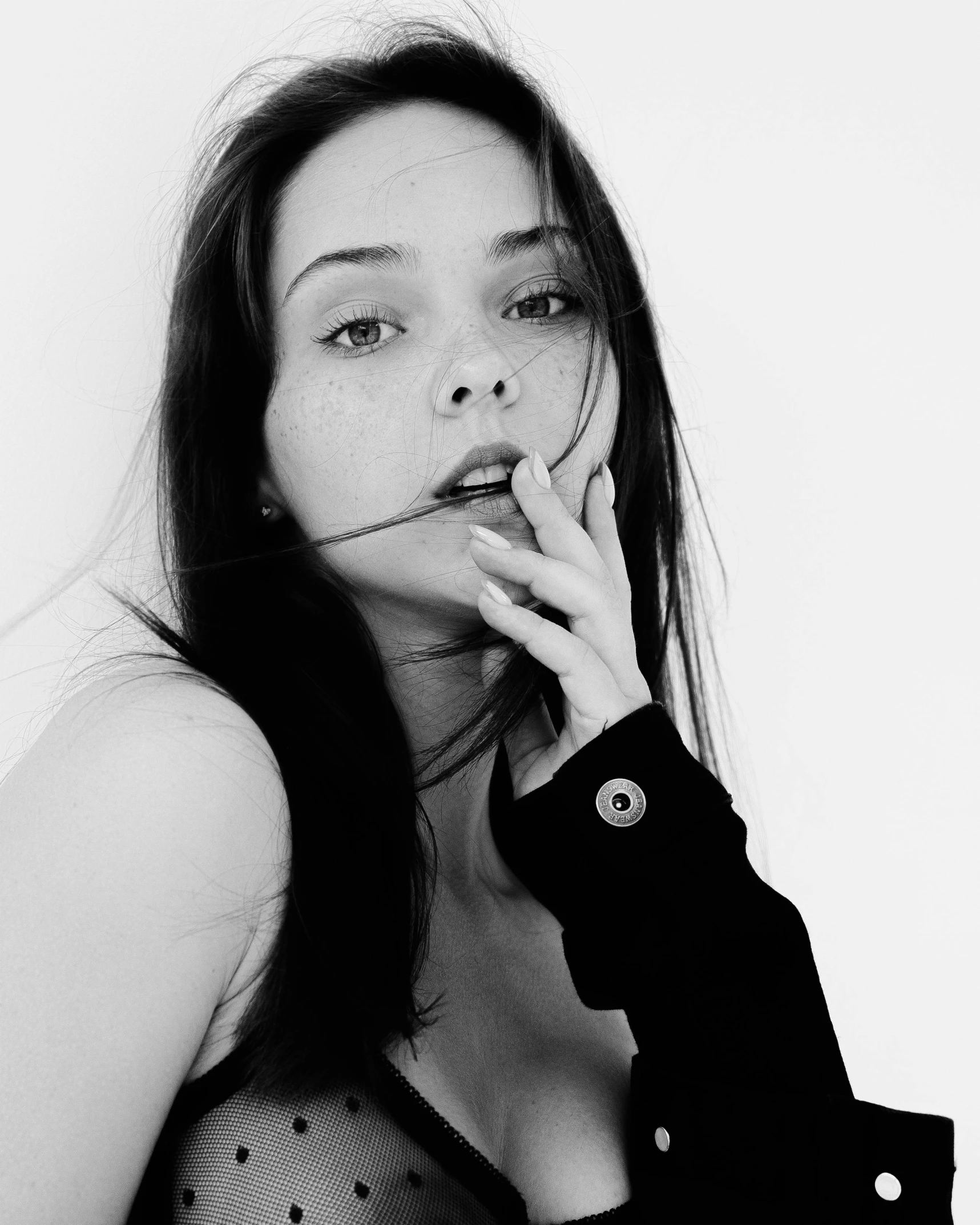 a black and white photo of a woman smoking a cigarette, a black and white photo, by Gavin Hamilton, dilraba dilmurat, beautiful young ornella muti, with fingers, pose 4 of 1 6