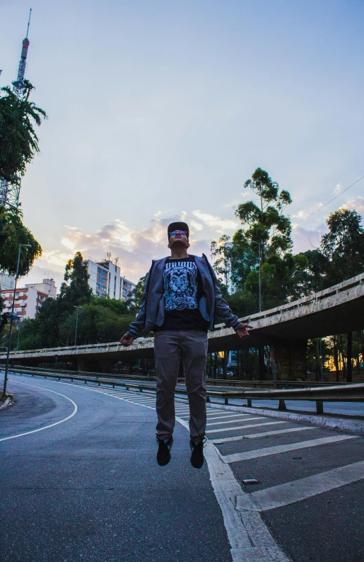 a man flying through the air while riding a skateboard, an album cover, unsplash, in sao paulo, standing in road, avatar image, deserted