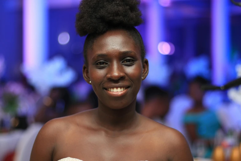 a woman in a white dress posing for a picture, by Chinwe Chukwuogo-Roy, pexels contest winner, happening, with brown skin, half-turned lady in evening gown, happily smiling at the camera, 15081959 21121991 01012000 4k