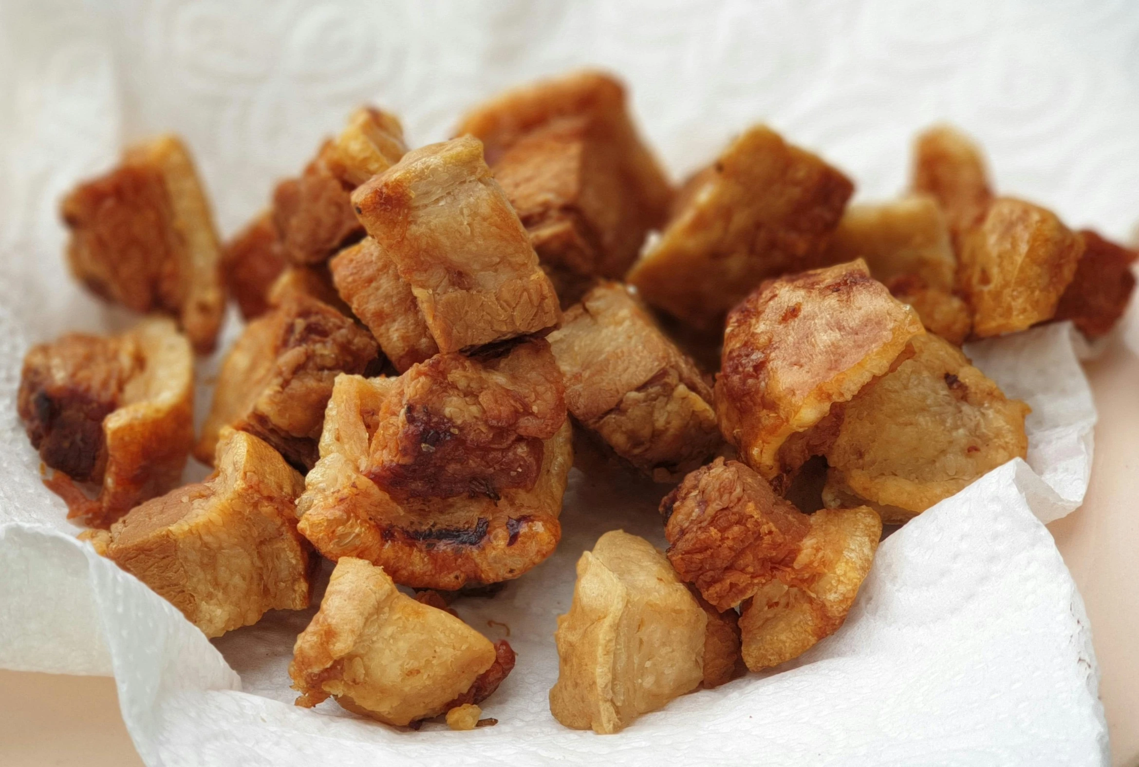 a close up of a plate of food on a table, deep fried, puṣkaracūḍa, square, beige