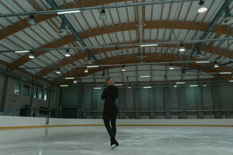a man standing on top of an ice rink, unsplash, arabesque, realistic footage, full body 8k, indoor scene, shot on sony a 7