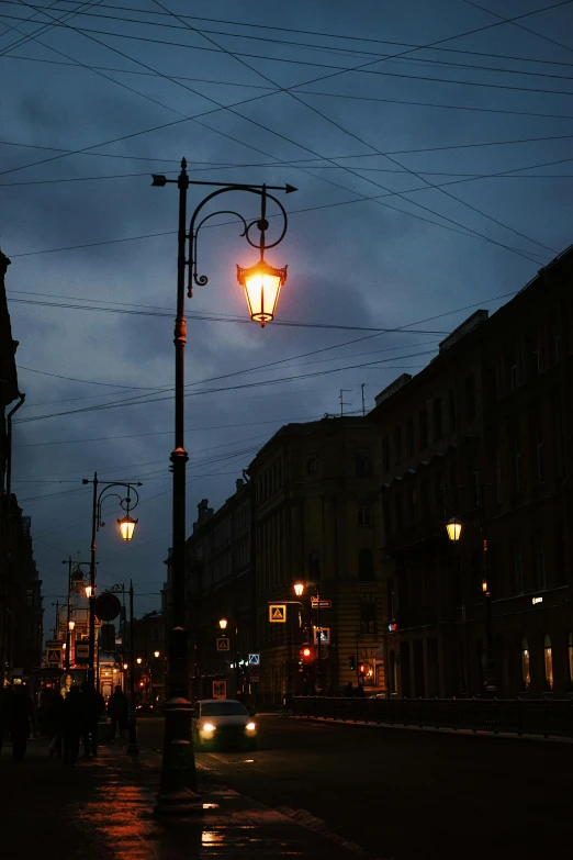 a street light sitting on the side of a road, by Serhii Vasylkivsky, baroque, saint petersburg, atmospheric lighting - n 9, hanging lanterns, square