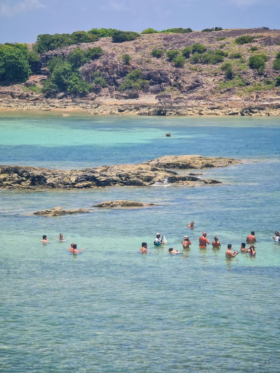 a group of people swimming in a body of water, by Epsylon Point, les nabis, tropical location, where's wally, high-quality photo