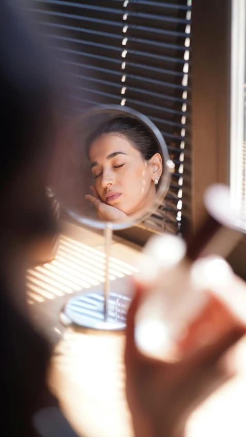 a woman taking a picture of herself in a mirror, by Olivia Peguero, trending on pexels, soft oval face, afternoon light, kiko mizuhara, essence