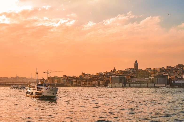 a large body of water with a boat in it, pexels contest winner, hurufiyya, fallout style istanbul, golden hour hues, city views, slide show