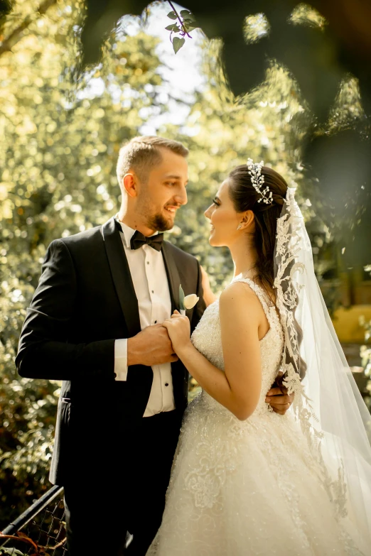 a man in a tuxedo and a woman in a wedding dress, pexels contest winner, trees in the background, romanian, sparkling in the sunlight, thumbnail