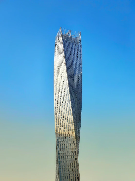 a very tall building in the middle of a city, inspired by Zha Shibiao, pexels contest winner, gutai group, profile image, arabia, full front view, full daylight