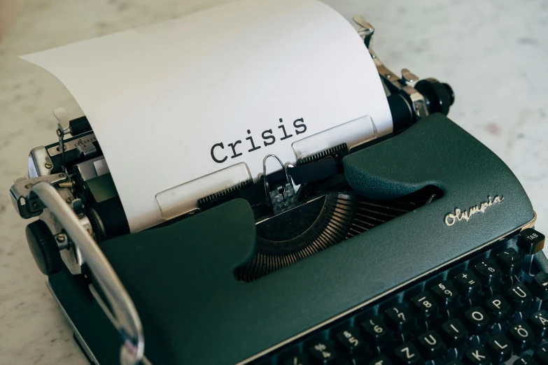 a close up of a typewriter on a table, a cartoon, by Carey Morris, trending on pexels, excessivism, disaster, crysis, broken signs, photograph of april