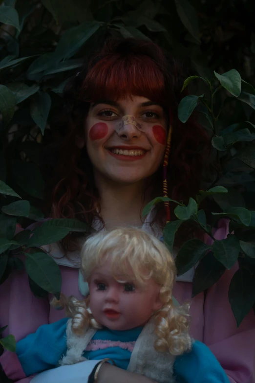 a woman holding a child in her arms, an album cover, by Elsa Bleda, reddit, doll face, melanie martinez, in the garden, red cheeks